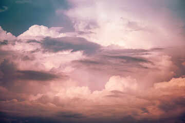 Naklejka na ściany i meble Beautiful stormy cumulus clouds in the sky, background.