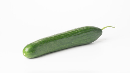 Green long cucumber on a white vegetable background