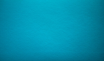 Photo of the texture of blue felt fabric. Fabric background the color of the sea breeze. Blue background for rectangular text.