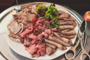 Catering table, beautifully decorated banquet with variety selection of different food snacks and appetizers on corporate birthday party event or wedding celebration, delicatessen setting