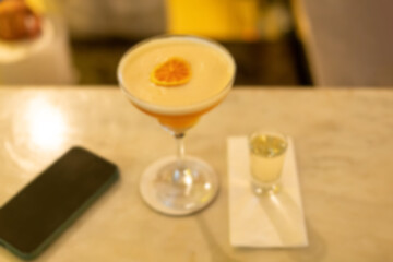 Blurred photograph, An alcoholic cocktail prepared at the bar.