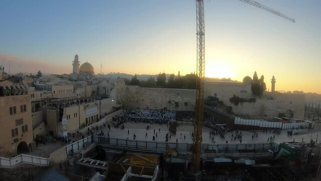 Thousands of worshipers at western wall at sunrise, timelapse 
Sukkot traditional holiday pray, Jerusalem,israel,october,05,2021
