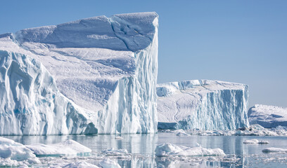 Towering great icebergs in the Ilulissat Icefjord in Greenland - Powered by Adobe
