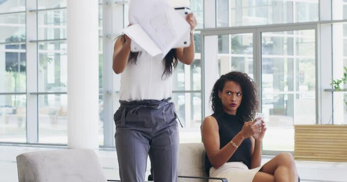 Business woman smashing, breaking or destroying her laptop in frustration out of stress and anxiety. Angry and crazy female throwing her computer and upset with job loss or a bad finance report