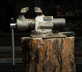 metal vise on a dark background