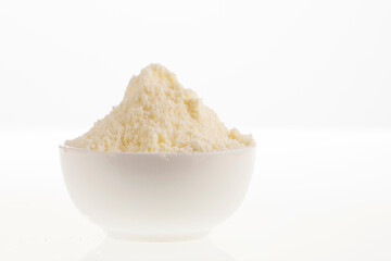 Powdered or dehydrated milk in the bowl
