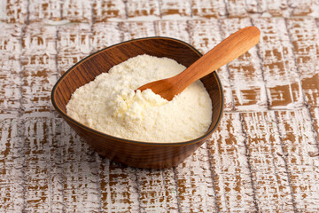 Powdered milk with nutrients in the bowl and spoon