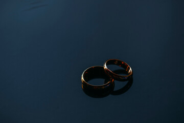 wedding rings on blue background