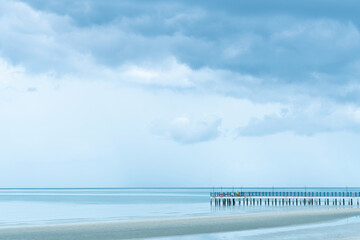 bridge with  blue sea water with white cloud nature background