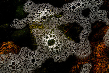 Sea foam scum on ocean water texture