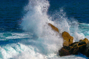 waves crashing on rocks