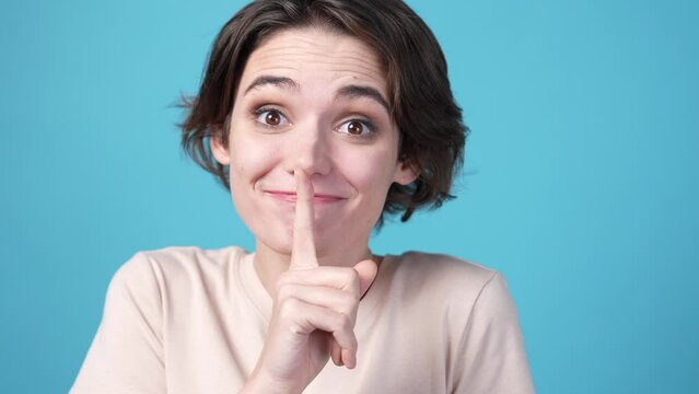 Funny lady share private secret isolated on blue color background