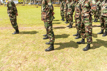 Unrecognizable soldiers of a Latin American army formed in platoon