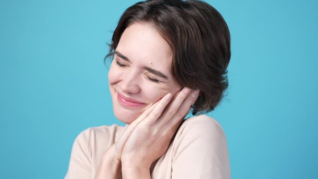 Cute lady pleading for dream gift isolated on blue color background 