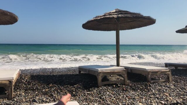 Sunbeds and parasol on a greek beach