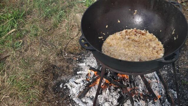 Cossack kulish. onions, meat and lard are cooked in a cast-iron cauldron on fire. The main field porridge of Ukraine