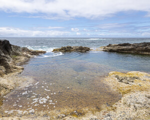Fototapeta na wymiar Natural sea pool on the beach taken on the island of Sao Miguel, Azores, Portugal