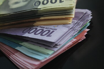 ten thousand rupiahs among many rupiahs of various nominal