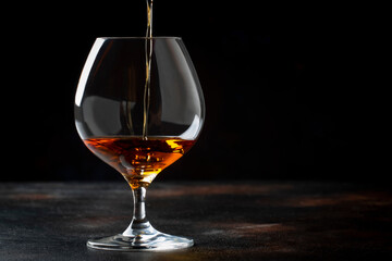 Godden Cognac Pour Into Glass, Vintage Brown Background,