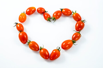 Tomatoes on white background. Heart tomatos.