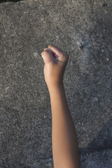 A child's hand clenched into a fist.