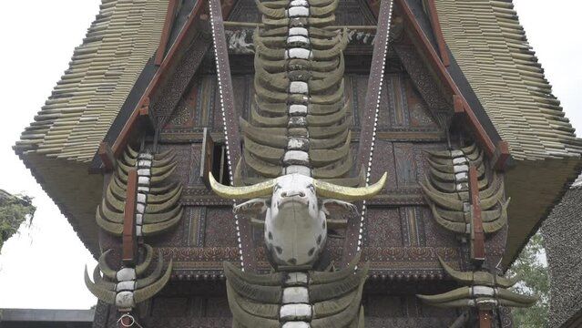 Tongkonan Traditional Ancestral House in Toraja, South Sulawesi, Indonesia - Buffalo Skulls Bones Horns in Row on Facade