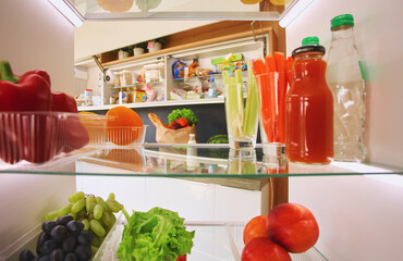 Open refrigerator with fresh fruits and vegetable. Open refrigerator