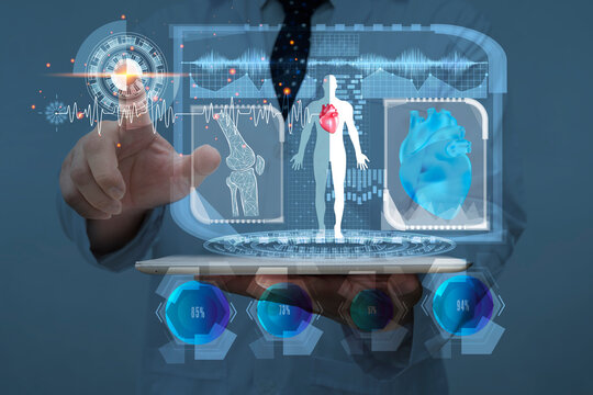 Doctor holding hand on start button if futuristic screen, futuristic medical technology, human anatomy scan and x-ray image