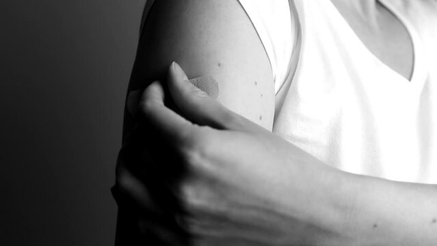 Applying medical wound patch on hand closeup