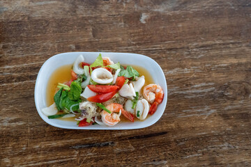 Spicy glass noodle salad. street food in Thailand.