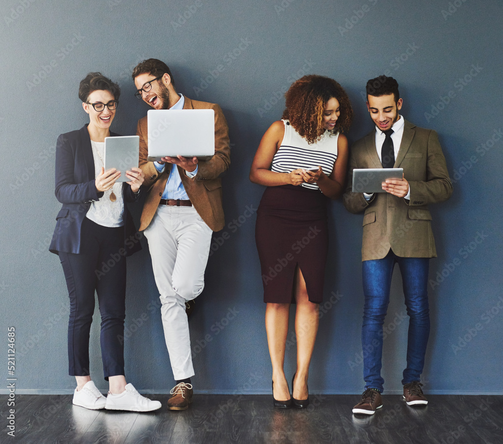Poster happy workers using digital devices standing together on a work break. group of relaxed employees us