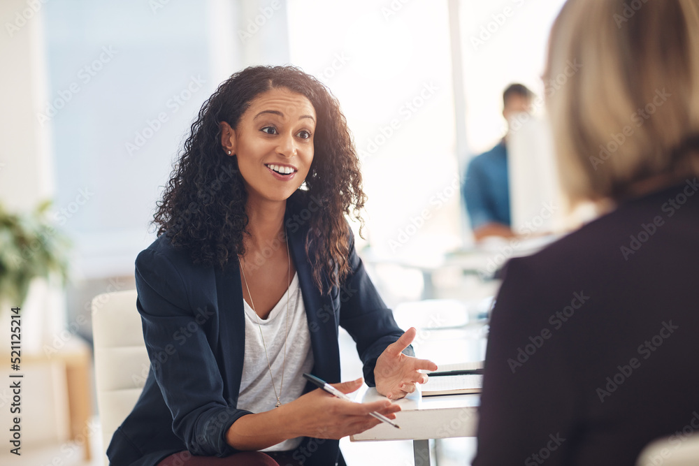 Poster Interview with a happy, excited and confident human resources manager talking to a shortlist candidate for a job. Young business woman meeting with a colleague or coworker in her office at work