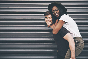 Cute, loving and affectionate interracial couple having fun, being playful and enjoying time...