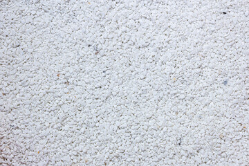 Small white pebbles and marble grain, little marble rocks background