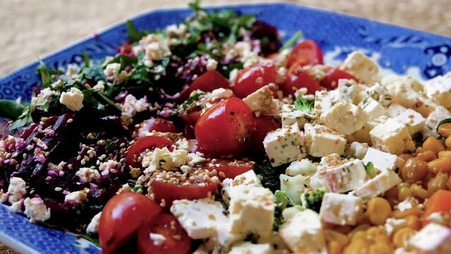 Nutritious looking raw mixed vegetable salad, colorful food; slider shot