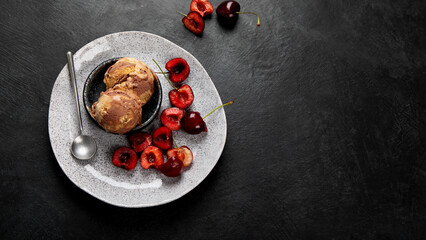 Chocolate ice cream with berries on dark background