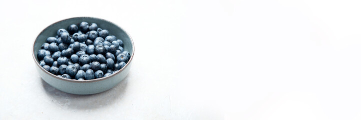 Fresh blueberry on neutral background.