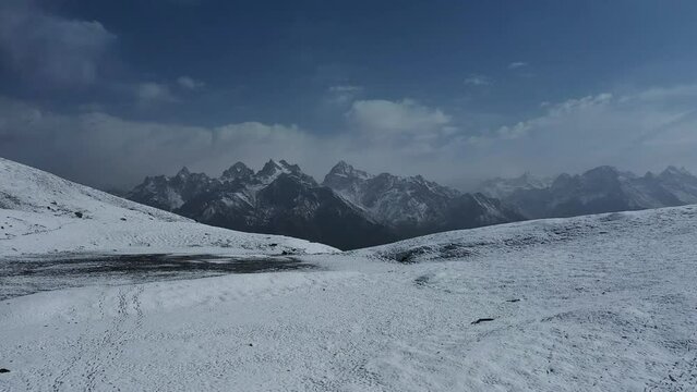 Mountain Scenery From The Snow-covered Sar Pass Top In The Indian Himalayas, Himachal Pradesh, India. wide aerial