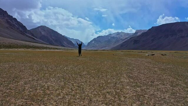 Traveler Enjoying Majestic Scenery In Sarchu Himachal Pradesh India - wide shot