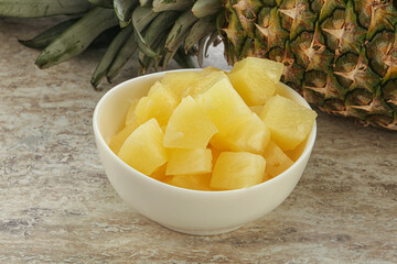Marinated pineapple slices in the bowl