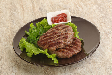 Grilled beef burger cutlet with sauce