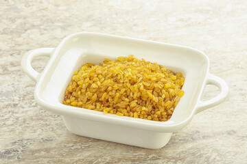 Raw bulgur in the bowl