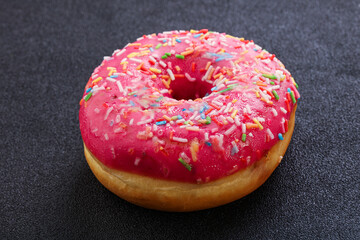 Sweet glazed struwberry donut with icing