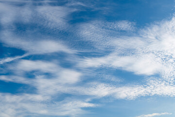 cirrus clouds in the blue daytime sky
