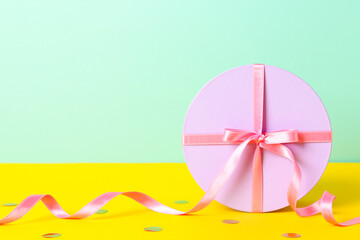 Concept of gift, gift box on two tone background