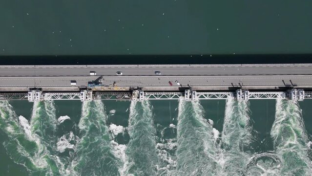 downward drone footage showing how strong the current is at the water locks on the delta works in the netherlands