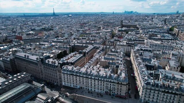 Paris aerial drone view, flying above train station gare du nord, backwards