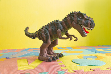 Tyrannosaurus T-rex, plastic toy, dinosaur with milkshake isolated on white background, resin...