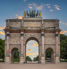 Fototapeta na wymiar Triumphal arch of the carousel of the city of Paris (France), located in the square of the carousel of the Parisian city next to the pyramid of the Louvre museum and on the margin of the Seine.