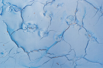 Obraz premium Dry blue oil paint cracks and crevices texture for background